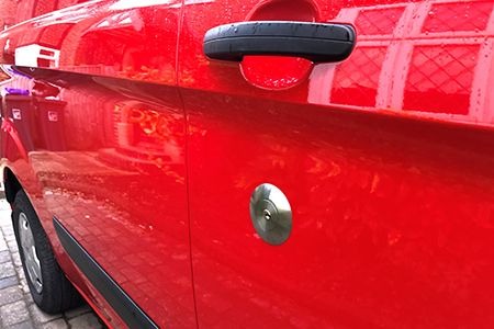 Chrome slam lock on red van